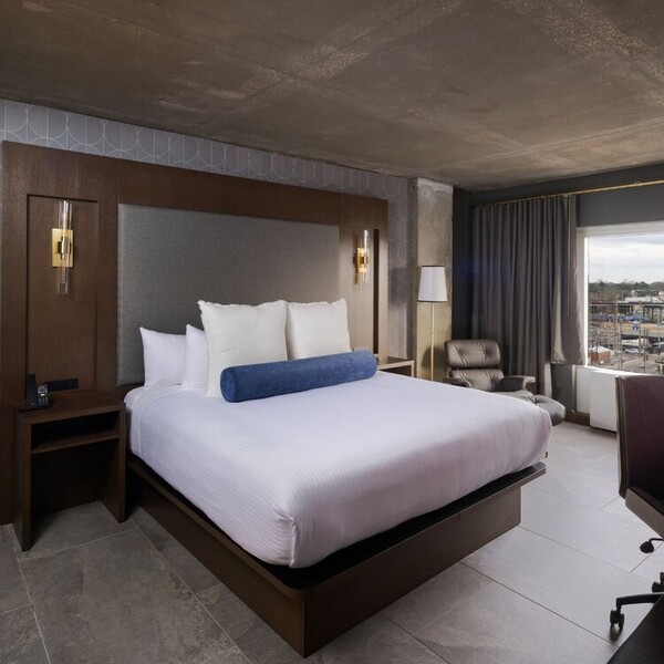 a room with a bed and a chair