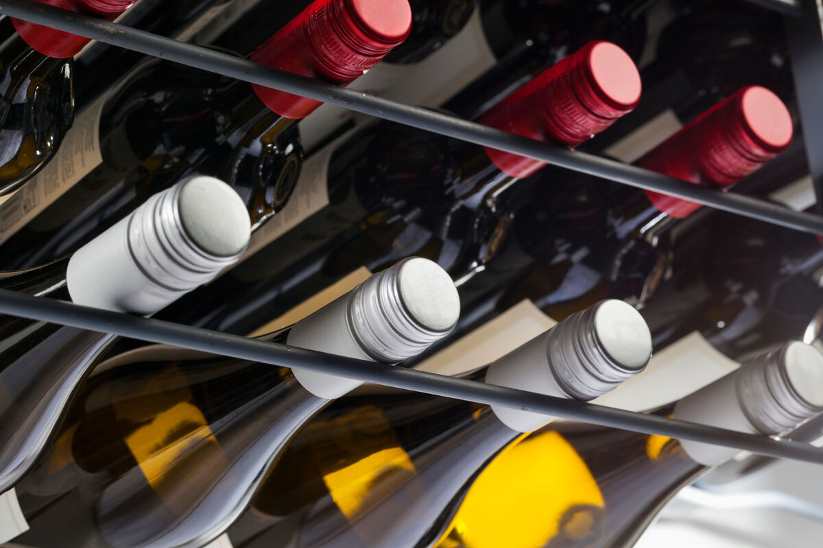 a group of wine bottles on a rack