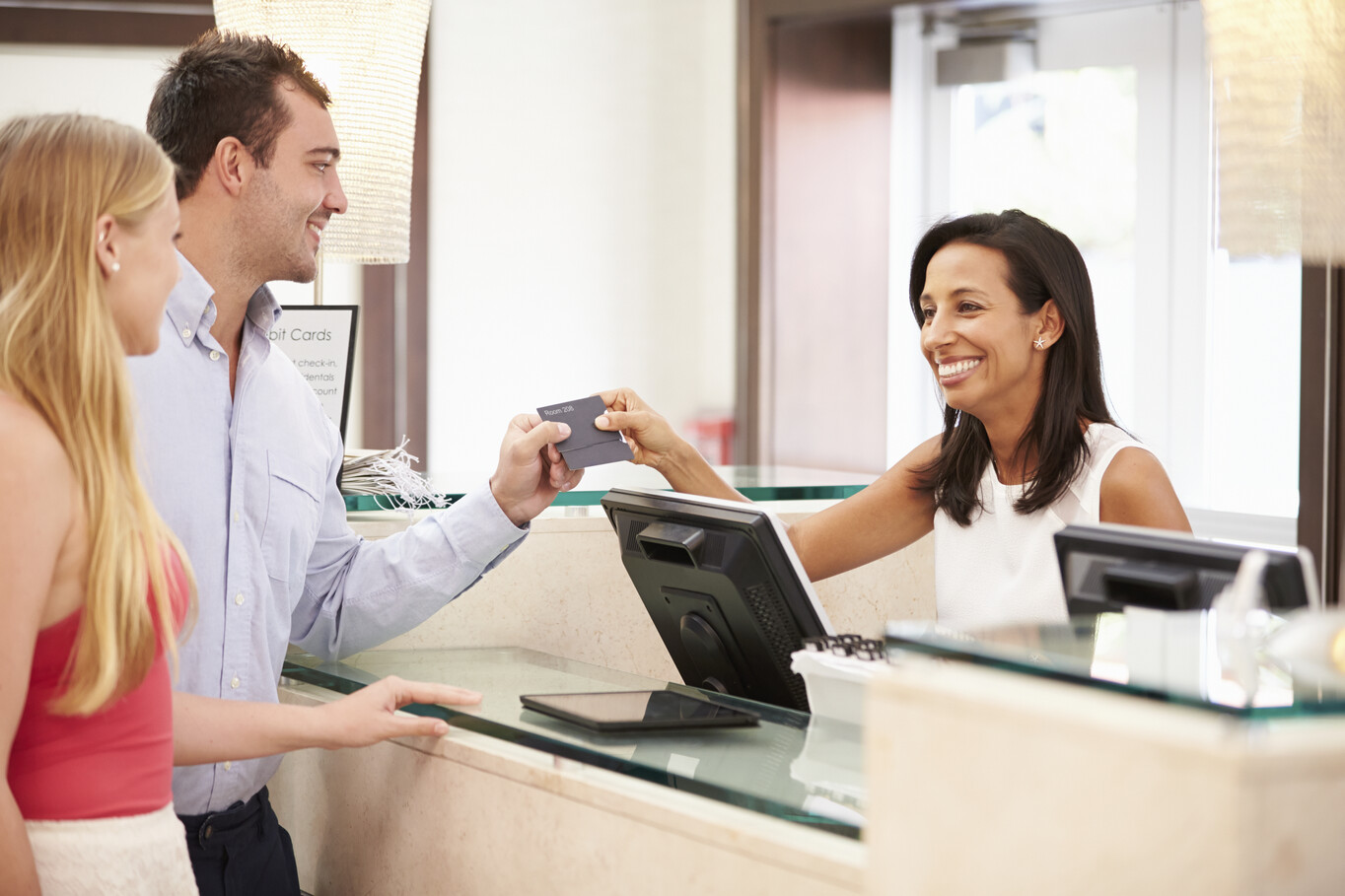 Couple checking into Hotel at Registration Desk