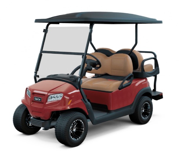 a red golf cart with tan seats