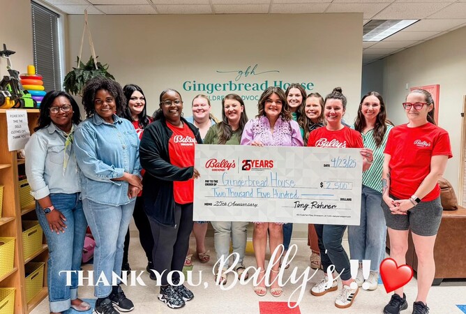 group of people with a check