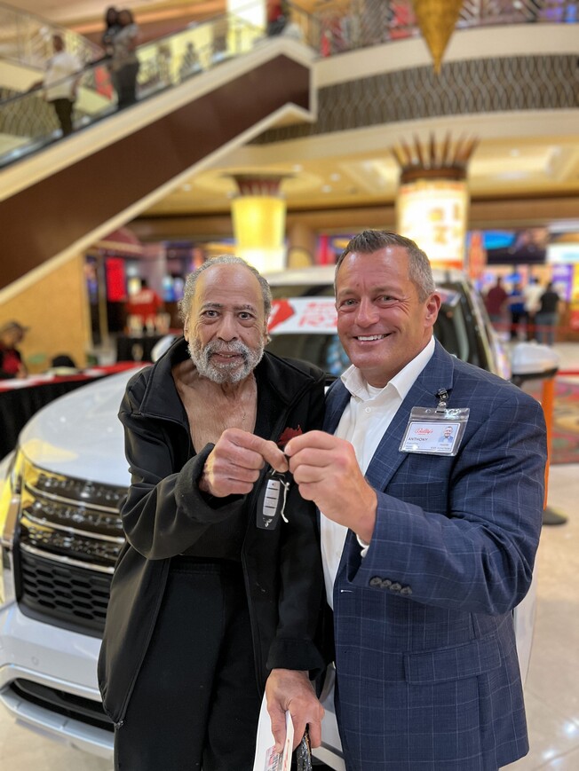2people holding car key