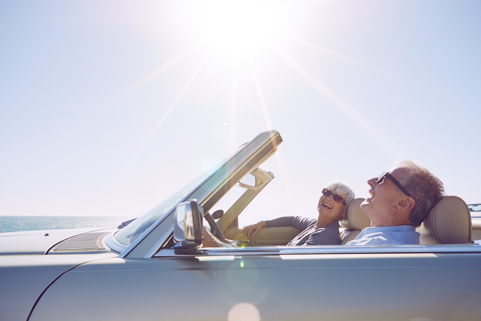 couple riding in a convertible